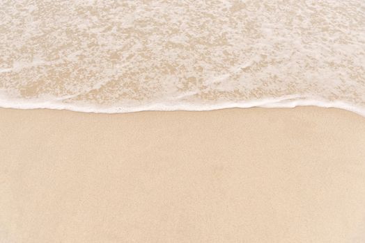 Soft wave on to the beach