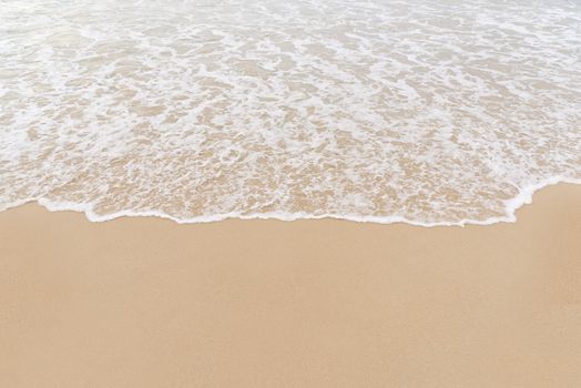 Soft wave on to the beach