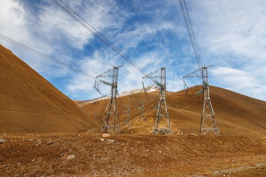 electricity pylons in the mountains of Kyrgyzstan, power lines in the mountains