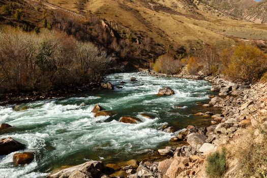 fast mountain river, autumn landscape, Kokemeren river, Kojomkul, Jumgal District Kyrgyzstan