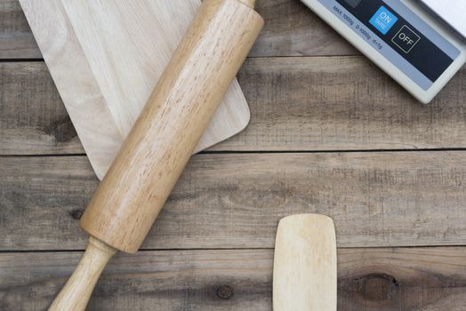 Wood bakery tool with  digital scales on wood table