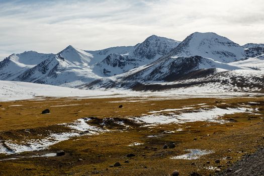 snowy mountain peaks on the Ala Bel pass, Bishke-Osh highway, M41, Kyrgyzstan