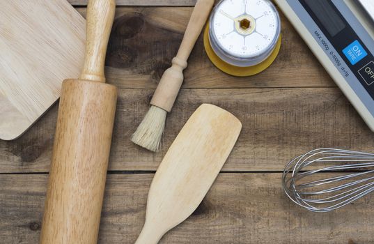 Bakery And Cooking Tools with kitchen timer, scales on wood table
