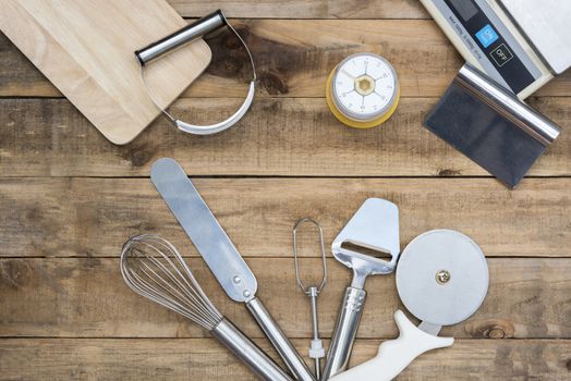 Bakery And Cooking Tools with kitchen timer, scales on wood table