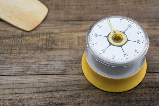 Bakery And Cooking Tools with kitchen timer on wood table