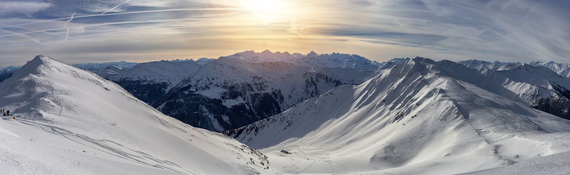 Panoramic view of beautiful winter wonderland mountain scenery in the Alps