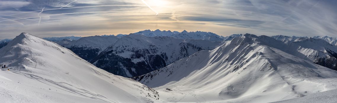 Panoramic view of beautiful winter wonderland mountain scenery in the Alps