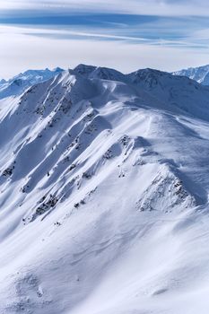 Winter snow covered mountain peaks in Europe. Great place for winter sports