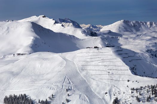 Snowy winter landscape of a ski resort in the Alps