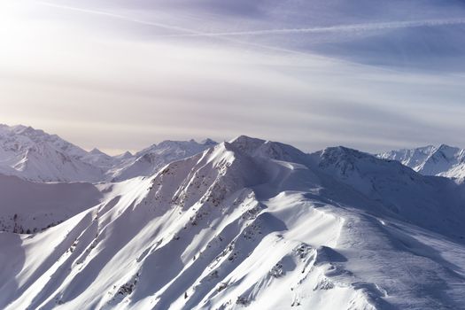 Winter snow covered mountain peaks in Europe. Great place for winter sports