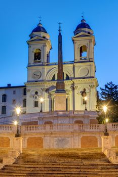 The Trinita dei Monti church and the Spanish Steps in Rome at twilight