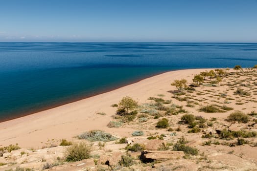 Lake Issyk-kul, empty sandy beach on the southern shore of the lake, Kyrgyzstan