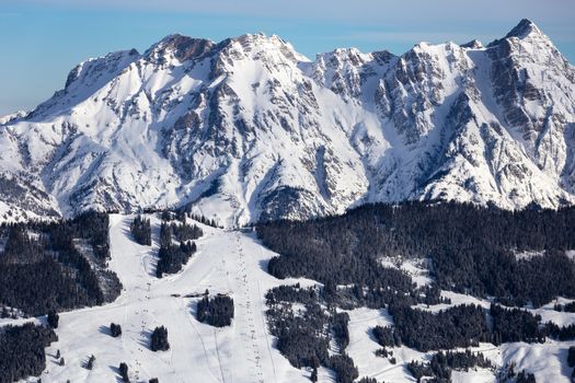 Winter mountains background with ski slopes and ski lifts. Skiing resort. Extreme sport. Active holiday. Free time concept