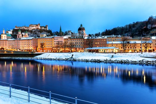 Beautiful view of Salzburg skyline with Festung Hohensalzburg and Salzach river at blue hour, Salzburger Land, Austria