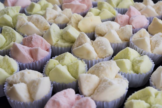 colorfull Thai dessert Thai steamed cupcakes or cakes cotton wool in paper cup on wood table
