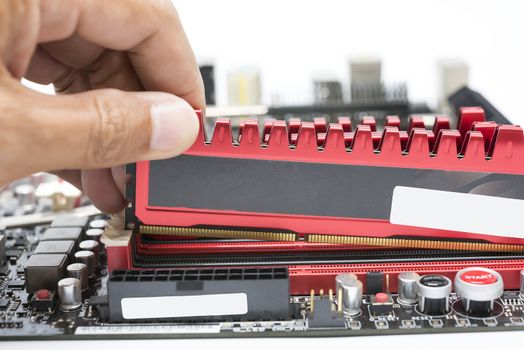 Close up hand install high performance  DDR3 ram to ram slot 
