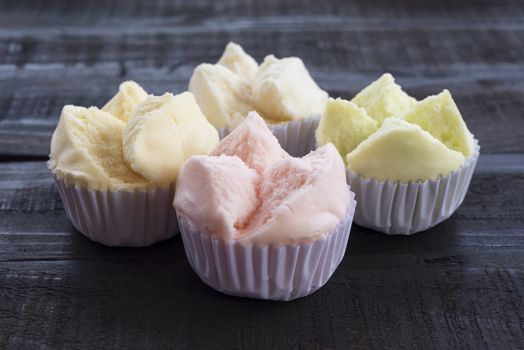 colorfull Thai dessert Thai steamed cupcakes or cakes cotton wool in paper cup on wood table