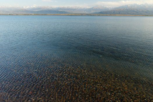 clear water in Issyk-Kul Lake, stones at the bottom of the lake, Kyrgyzstan.