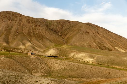 house and farm in the mountains of Kyrgyzstan.