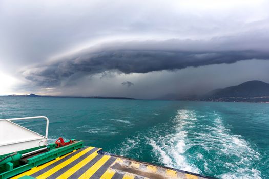 Running from fast coming storm with boat, approaching storm on lake