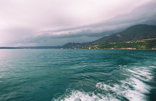 Running from fast coming storm with boat, approaching storm on lake