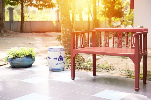 Red classic chiness style armchair in garden
