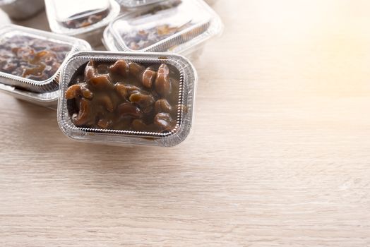 Cashews nut toffee cake in foil cup package