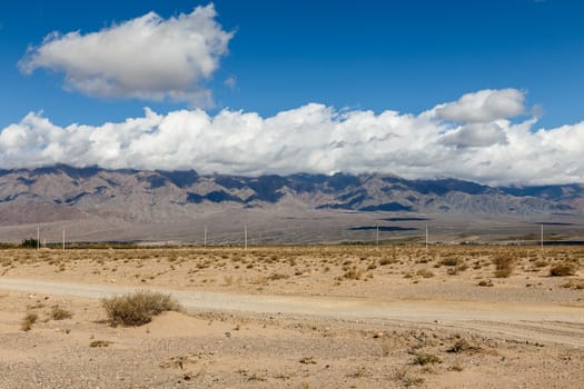 white clouds on the tops of mountains in the region of Issyk-Kul Lake, Kyrgyzstan