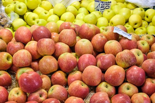 Red and yellow apples for sale at a market