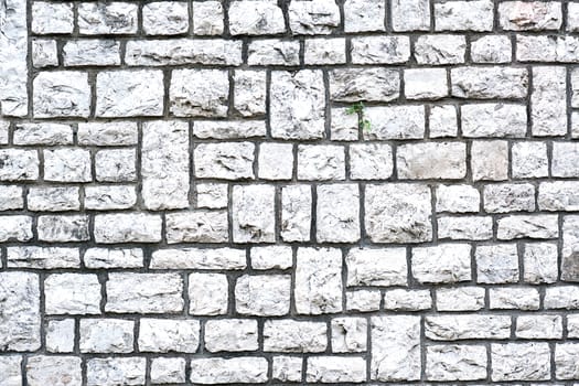 Background from a wall made of block shaped natural stones