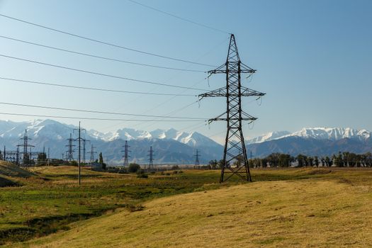 high-voltage power line in the mountains, electric high voltage power post, Chuy Region, Kyrgyzstan