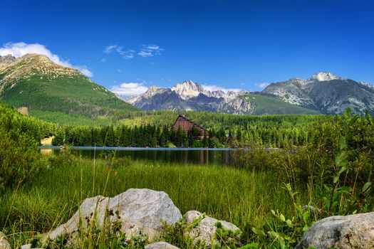 Strbske pleso. High tatras mountains. Vysoke tatry. Autumn forest. Reflection in lake. Beautiful landscape. Slovakia. Hotel Patria