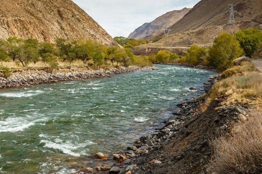 Kokemeren river, Kyzyl-Oi, Jumgal District, Kyrgyzstan, mountain river autumn landscape