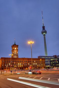 The town hall and the famous Television Tower in Berlin at night with car traffic
