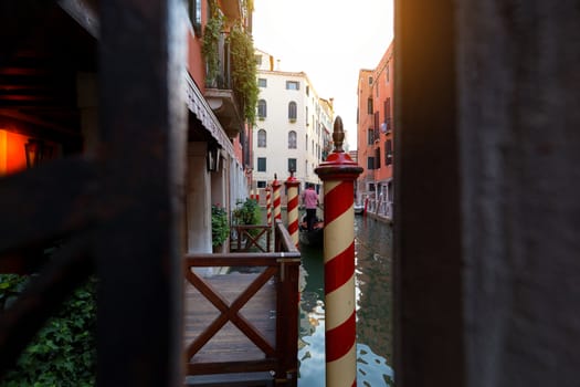 Small canal in venice with old buildings balconies a fading painted walls