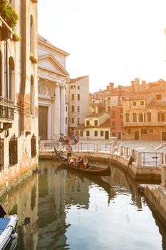 Italy, Venice - July 22, 2017: Gondola ride in small canal