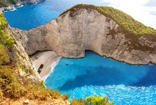 Navagio beach with blue crystal water, Zakynthos island, Greece