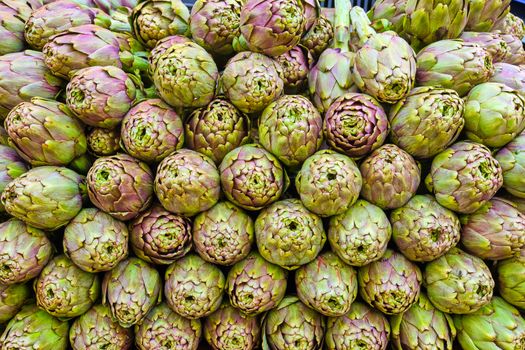 Pile of artichokes for sale at a market
