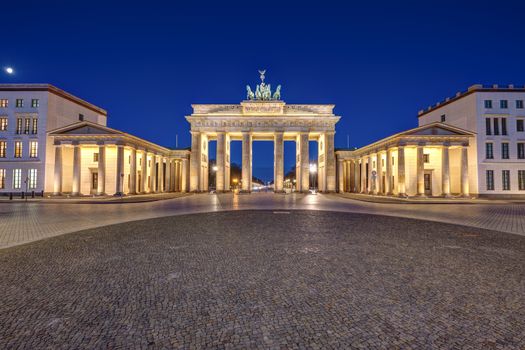 Panorama of the famous illuminated Brandenburg Gate in Berlin at night with no people