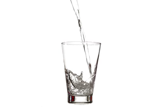 water splashing to glass isolated on white background
