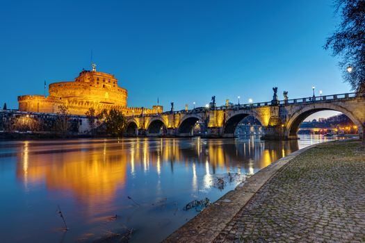 The Castel Sant Angelo and the Sant Angelo bridge in Rome at twilight