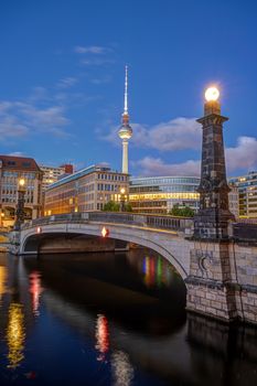 Historic bridge over the river Spree in Berlin at dawn with the Television Tower in the back