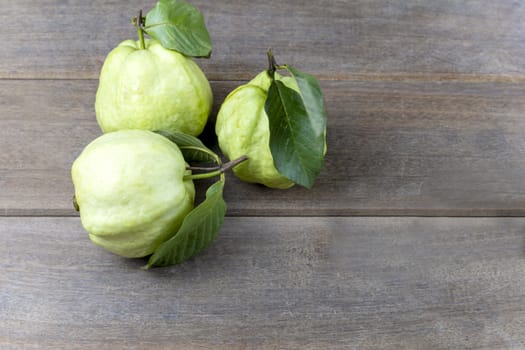 Top view fresh guava fruit on wood table with copy space for text or design.