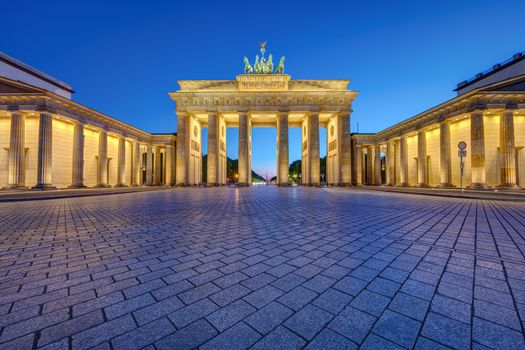 The famous illuminated Brandenburg Gate in Berlin at twilight with no people