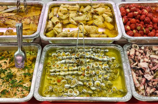 Different kinds of antipasti for sale at a market
