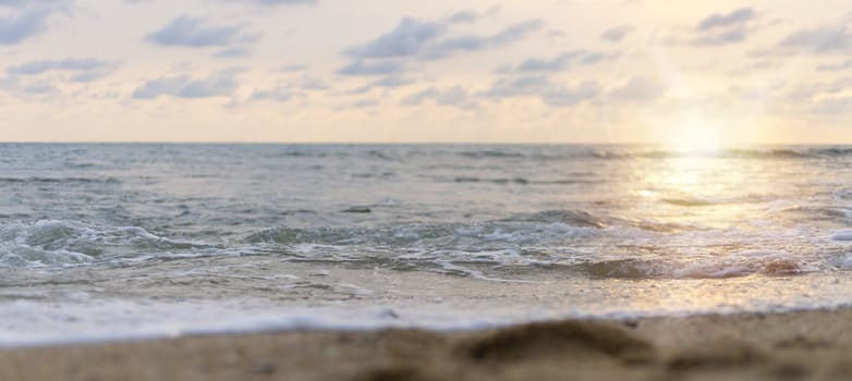 close up sand of sea sand and sunset sky. With copy space for text or design.