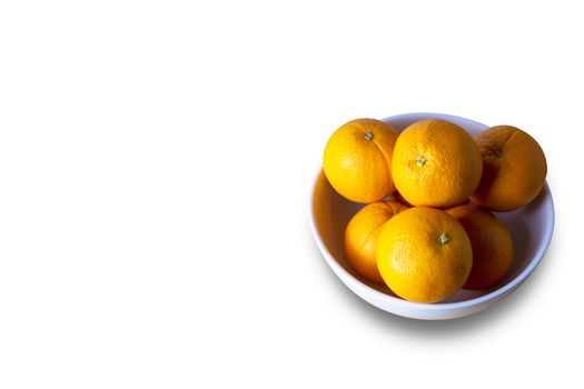 Orangs in white bowl isolate on white background. Save with clipping path