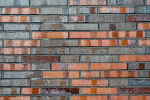 Background from a brick wall with different shades of red