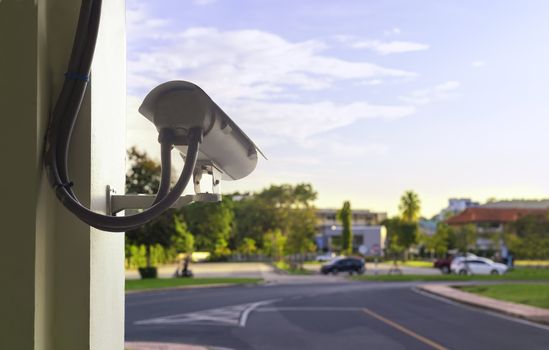 CCTV camera security at outdoor parking lot. With copy space for text or design.