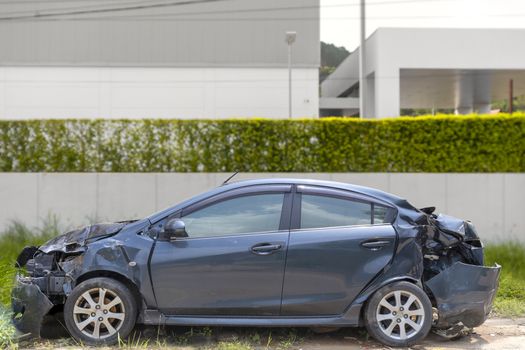Gray color car damaged and broken by accident on road parking can not dirve any more